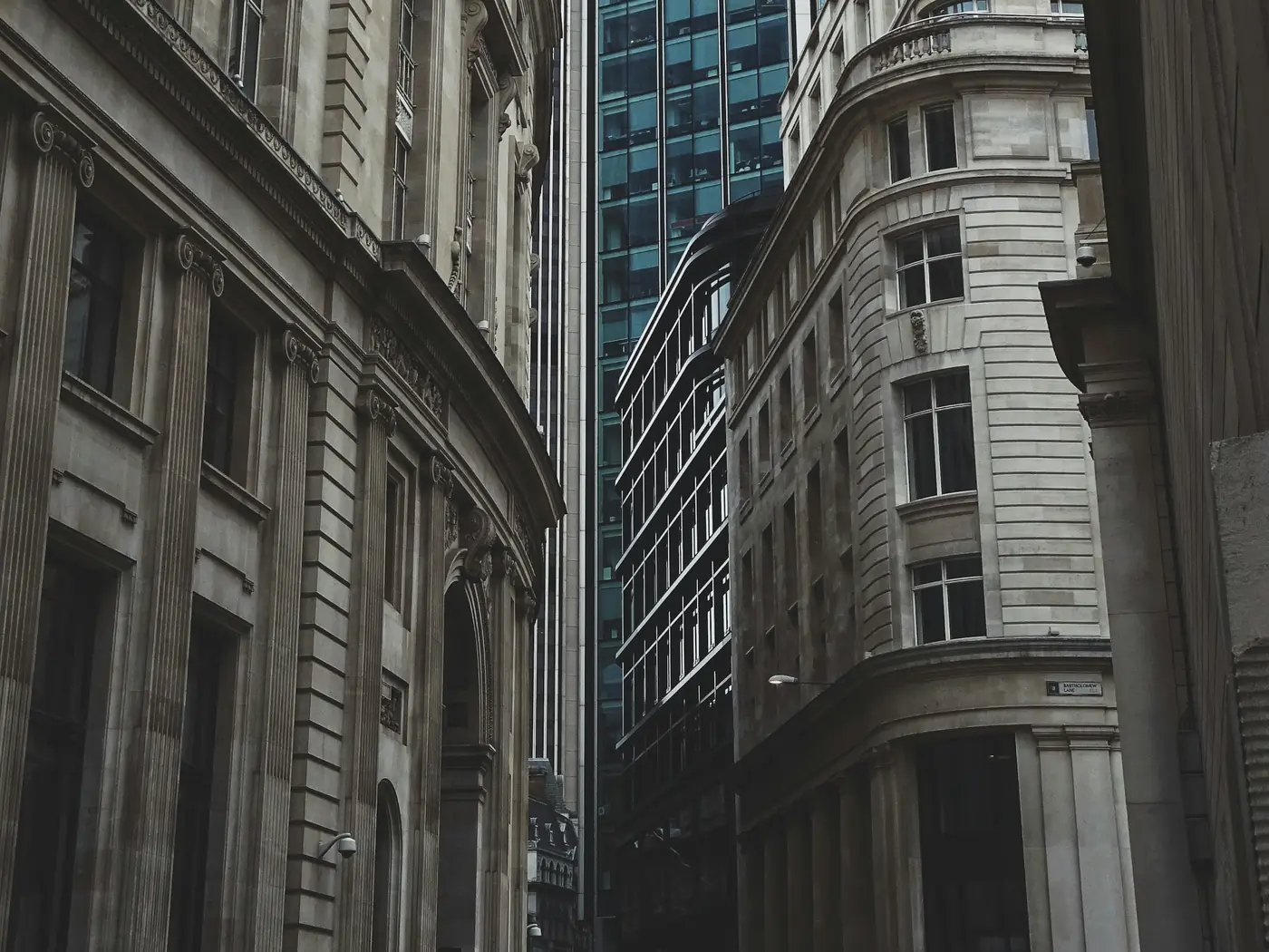Looking up between tall office buildings